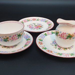 Wedgwood Creamer and Sugar Bowl plus 3 Saucers